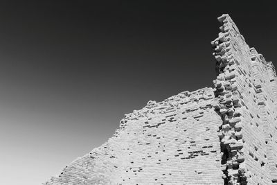 Low angle view of swansea castle against clear sky