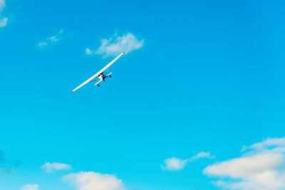 Low angle view of airplane flying in sky