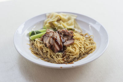 Close-up of noodles in bowl on table