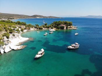 High angle view of sailboats in sea against sky