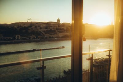 Buildings in city at sunset