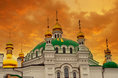 Low angle view of cathedral against cloudy sky