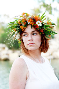 Portrait of woman with red flowers