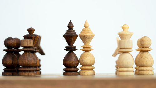 Close-up of chess board against white background