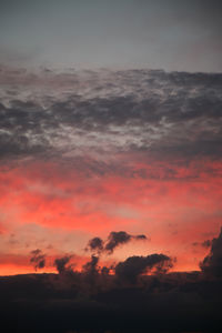 Low angle view of dramatic sky during sunset