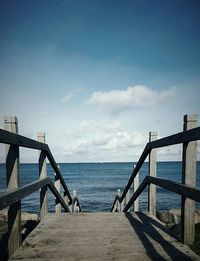 Pier on sea against sky