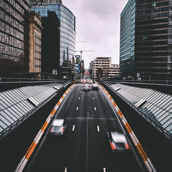 City street and modern buildings against sky