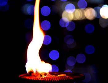 Close-up of illuminated light painting against black background