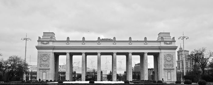 Low angle view of building against cloudy sky