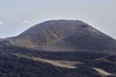 Scenic view of volcanic mountain against sky