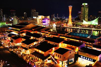 High angle view of illuminated buildings in city at night