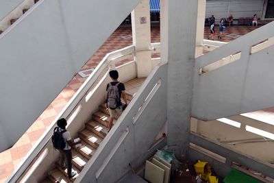 High angle view of boys walking on steps in rochor centre