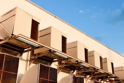 Low angle view of building against clear blue sky