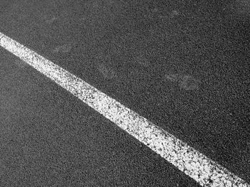 High angle view of single line on asphalt road