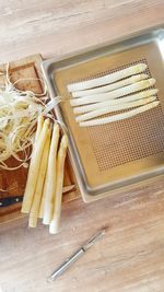 High angle view of asparagus in container on table