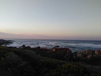 Scenic view of sea against sky at sunset