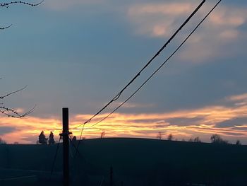 Silhouette landscape against sky during sunset