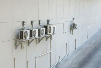 Row of clothes hanging on wall