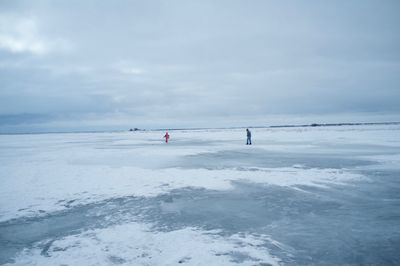 Scenic view of frozen sea against sky