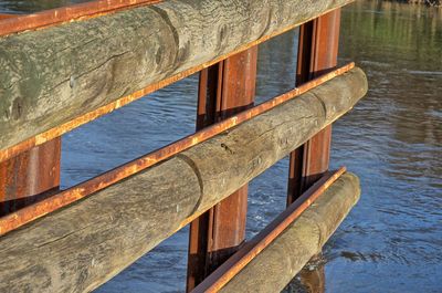 Close-up of pier over lake