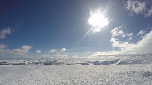 Scenic view of desert against sky during winter