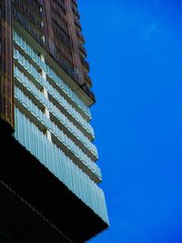 Low angle view of built structure against blue sky