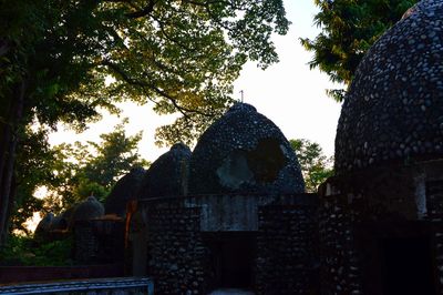 Low angle view of cross against sky