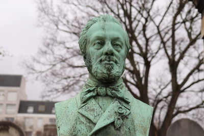 Close-up of statue against trees