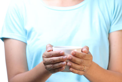 Midsection of woman holding hands