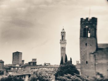 Buildings in city against sky