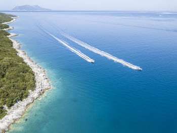 High angle view of boats on sea shore