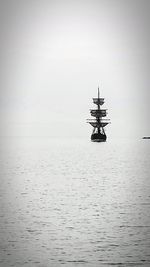 Boat sailing in sea against sky