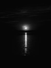 Scenic view of sea against sky at night