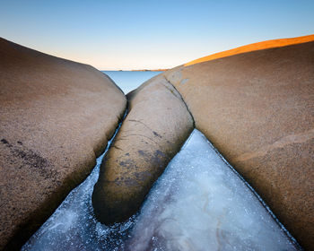 Frozen coastal landscape with ice in front of sea, sweden.