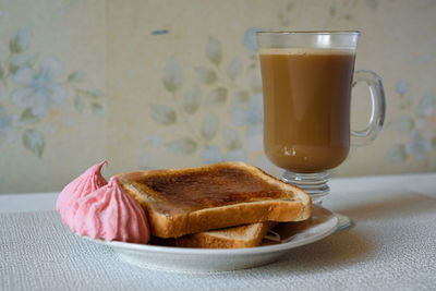 Close-up of breakfast served on table. toast and coffee.