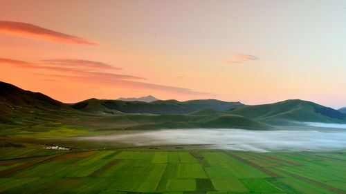 Scenic view of landscape against sky during sunset