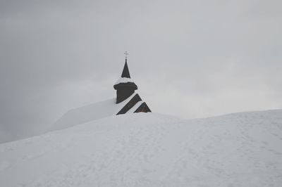 Snow covered mountain against sky