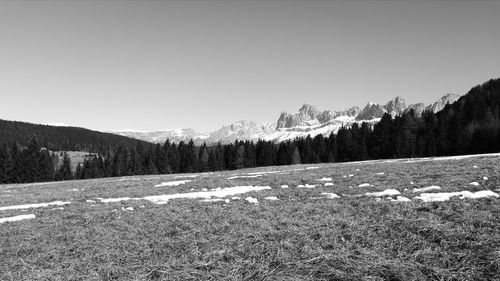 Scenic view of landscape against clear sky during winter