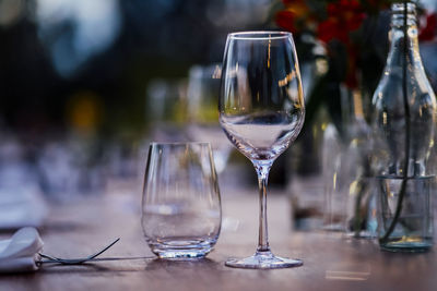 Luxury table settings for fine dining with and glassware, pouring wine to glass.beautiful background