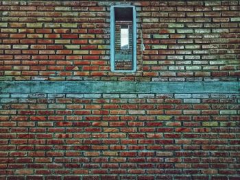 Low angle view of brick wall