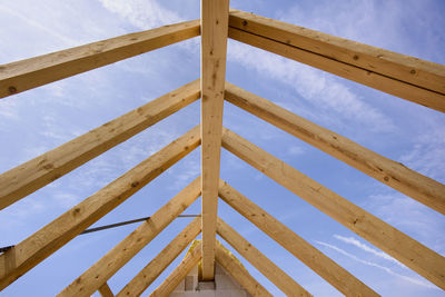 Low angle view of construction site against sky