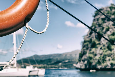 Close-up of sailboat in sea against sky