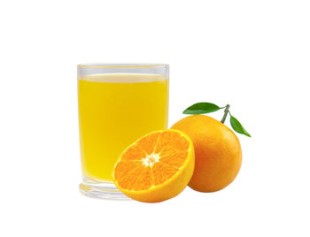 Orange fruit against white background