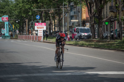 Man riding bicycle on road