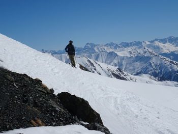 Scenic view of snowcapped mountains against clear sky