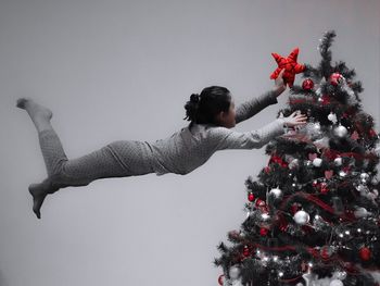 Man with christmas tree in winter