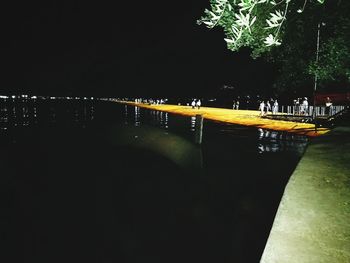 Illuminated bridge at night