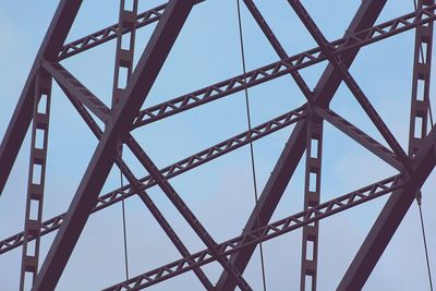 Low angle view of metallic structure against sky