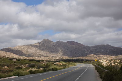 Empty road against sky