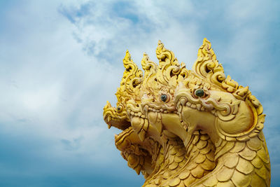 Low angle view of statue against sky